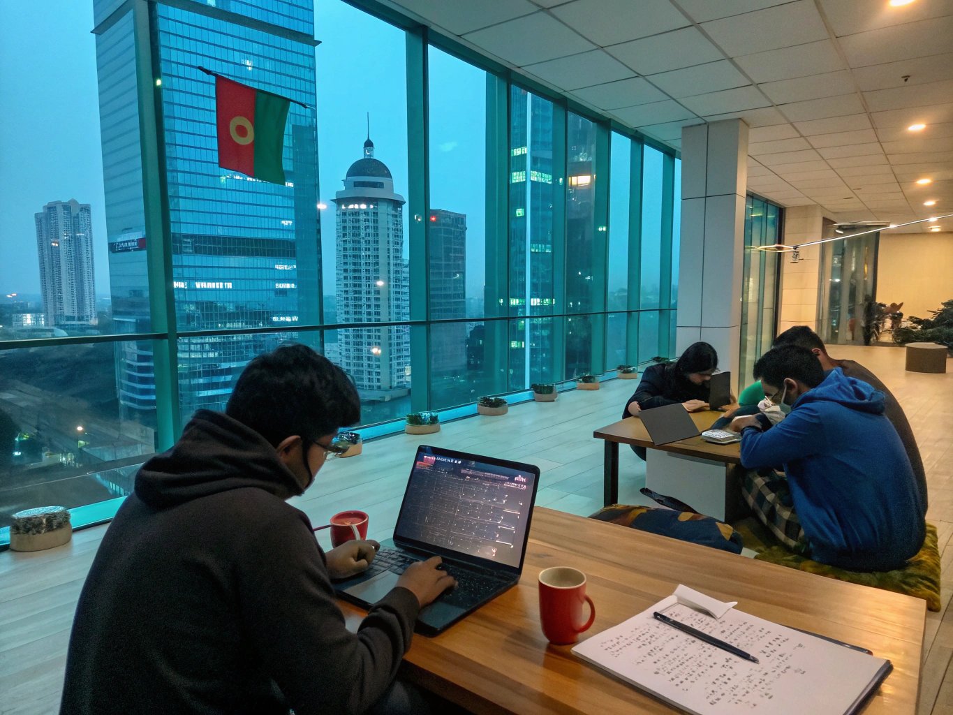 STUDYNEXT counselors assisting a student and parent in the Dhaka office